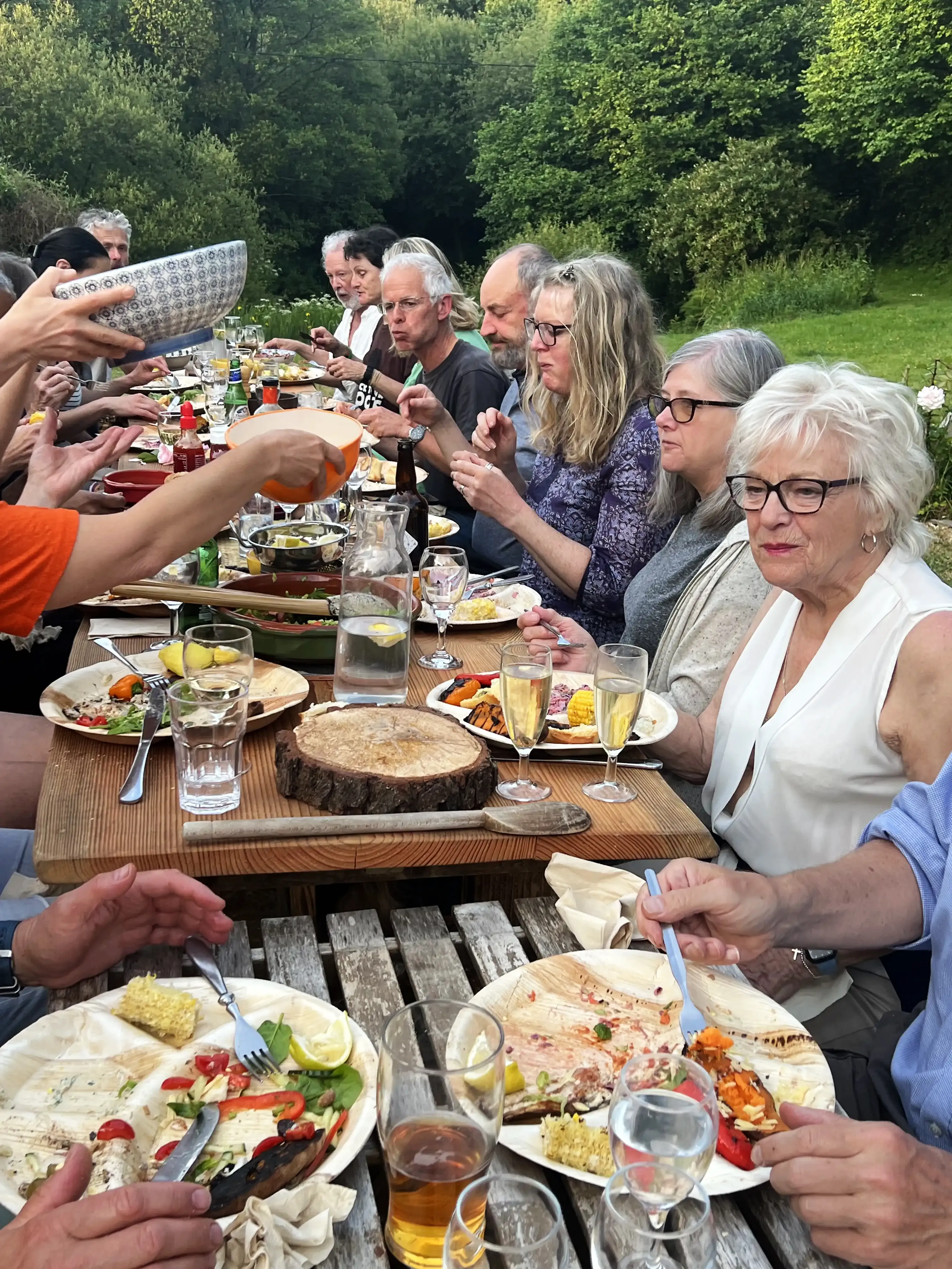 Overhead view of sharing bowls and platters on a rustic table