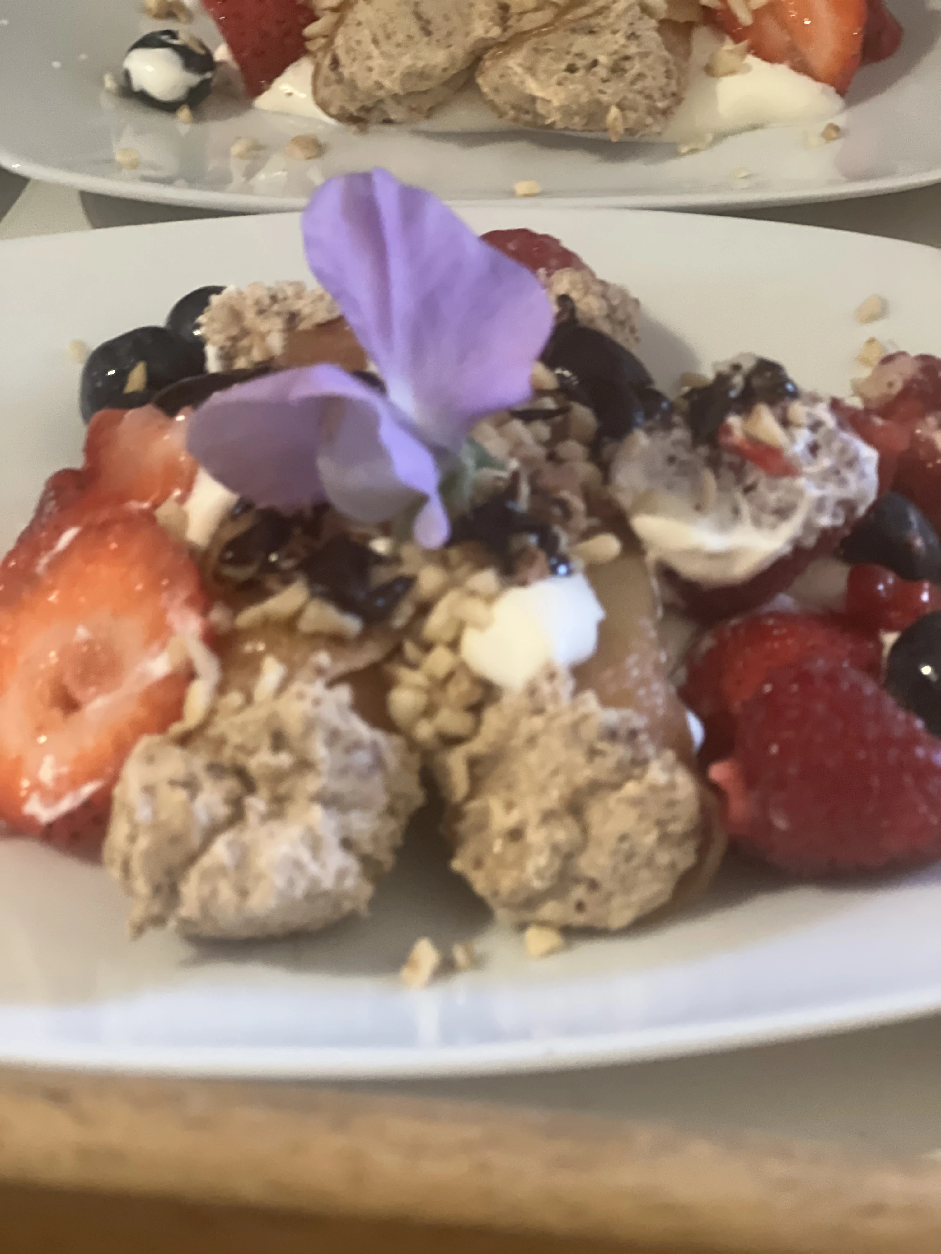 Long table dinner indoors with guests enjoying a feast