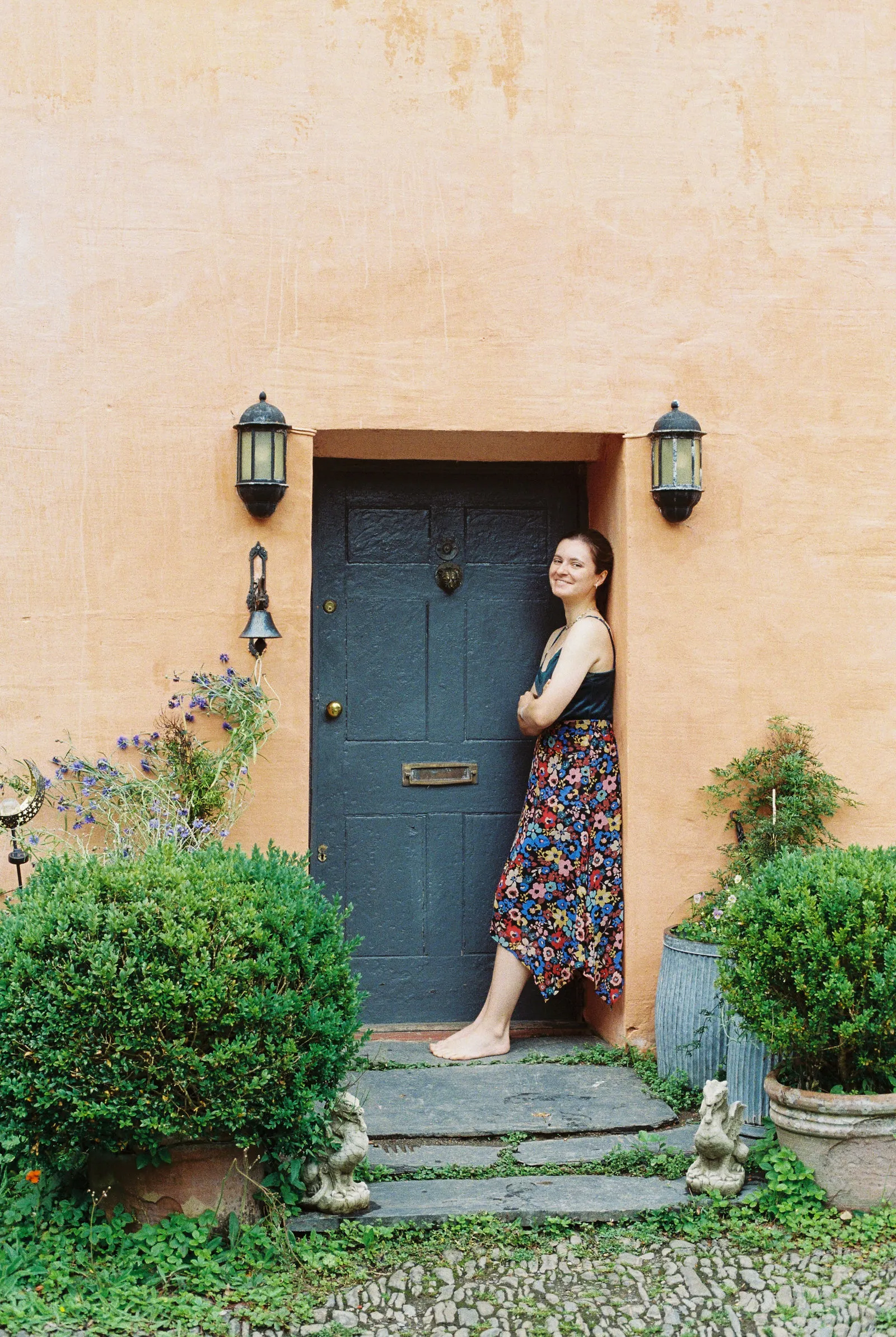 Velindre House exterior framed by trees and cottage-style planting