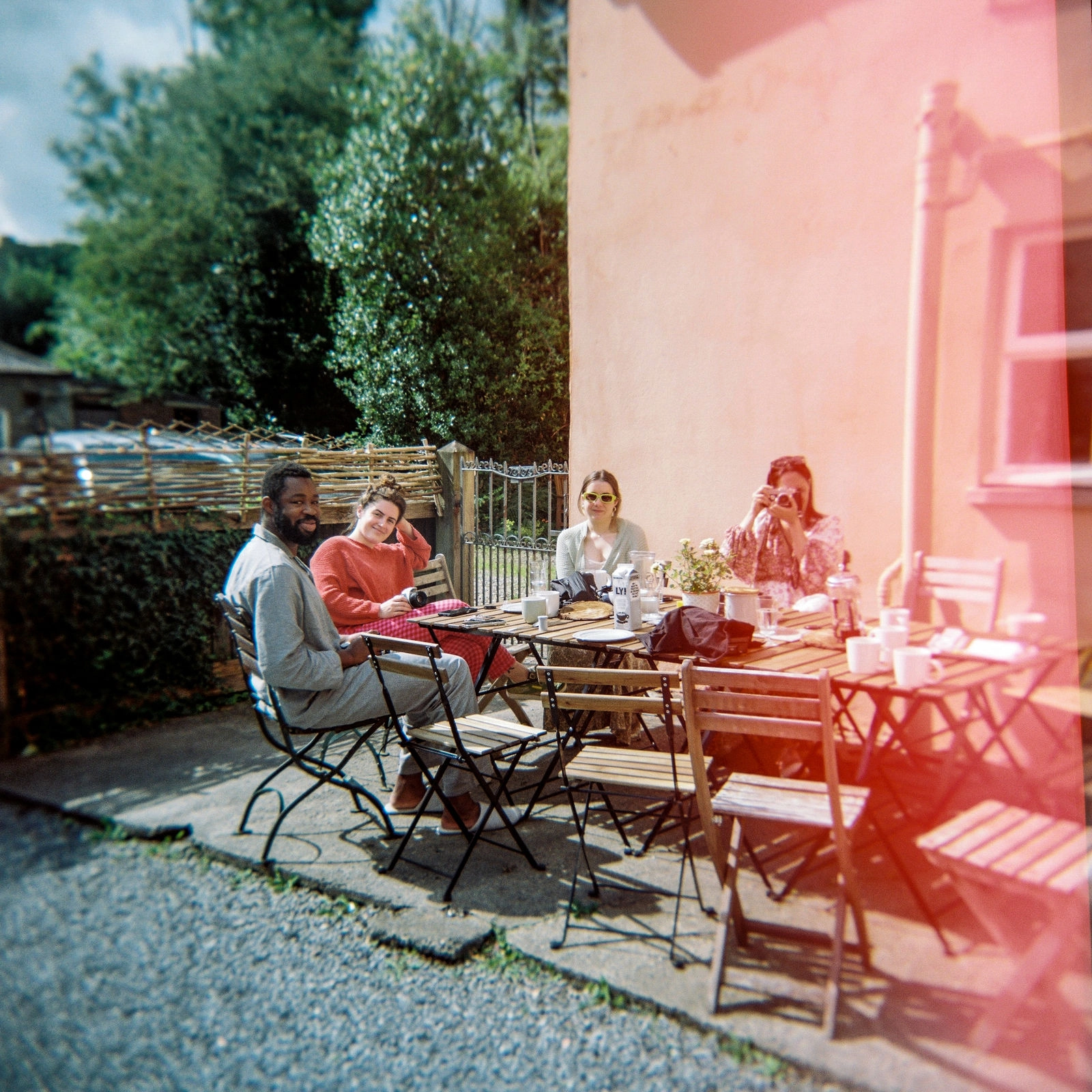 Lounge with leather sofas, wood-burner and patterned rugs