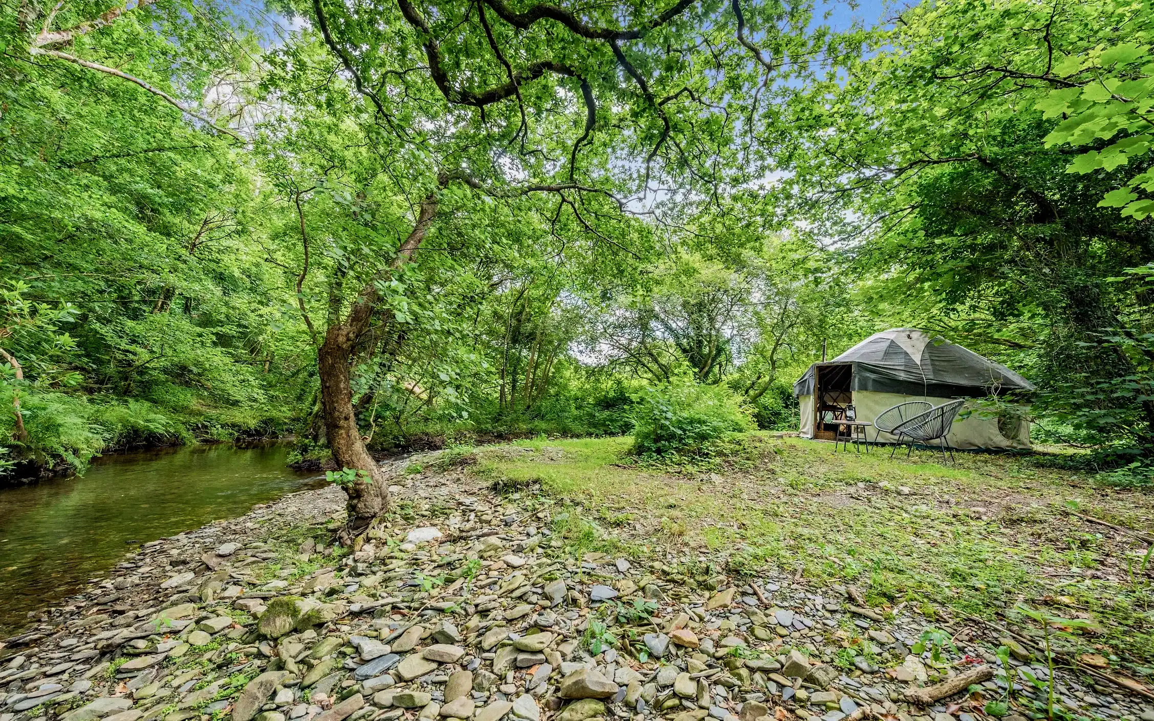 Lounge with leather sofas, wood-burner and patterned rugs
