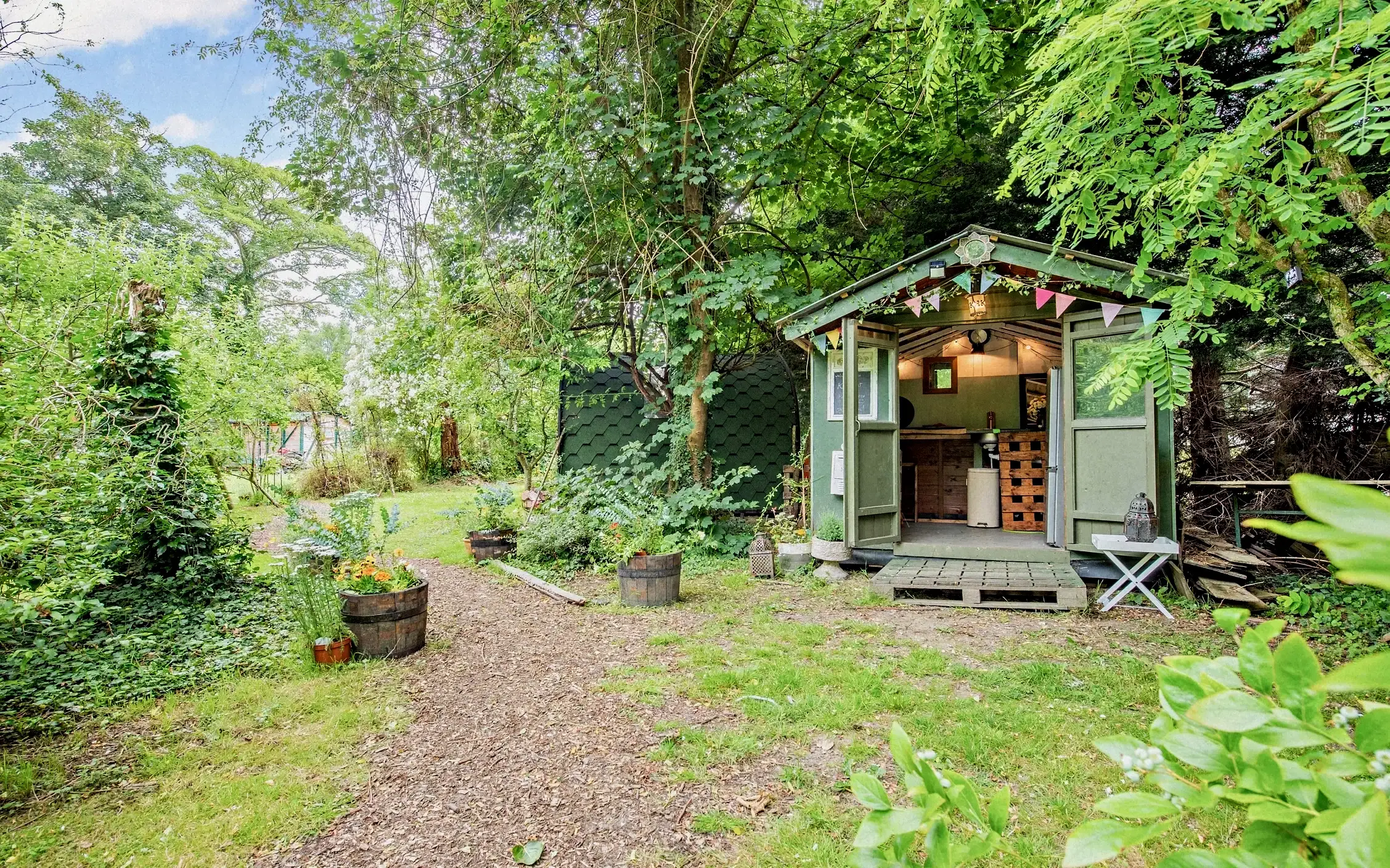 Lawn and tree-lined meadow on the grounds